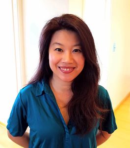 Mary smiling and wearing a Karsant Dentistry blue shirt